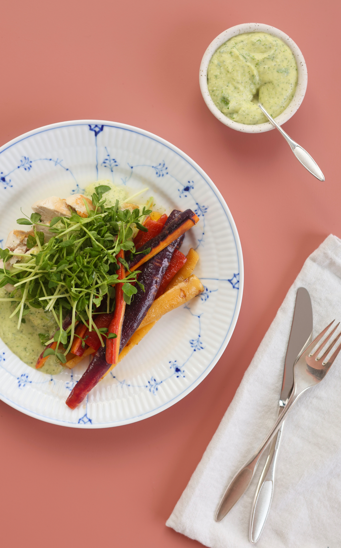 Pan-roasted carrots with creamy zucchini sauce and pea shoots